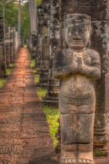 Fototapeta na wymiar Ancient stone statue in a serene temple corridor