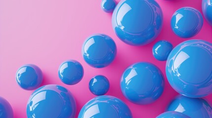 a group of blue balls sitting on top of a pink and pink surface with a pink and blue wall in the background.