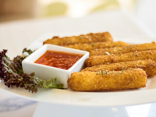 Cheese Fingers sticks with chilli sauce served in dish isolated on table side view of arabic fastfood