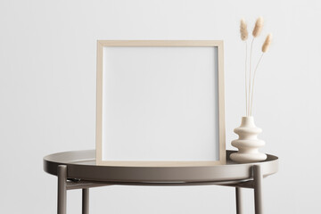 Wooden square frame mockup with a candle decoration on the beige table.