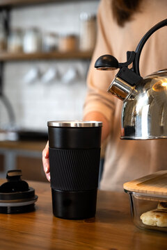 pour tea or coffee into a thermal mug. pour boiling water over it.