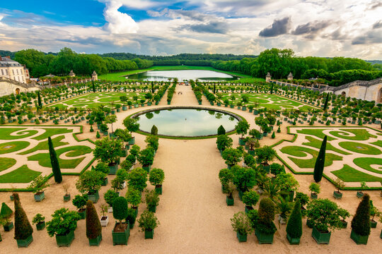 Versailles formal gardens (Orangery) outside Paris at sunset, France