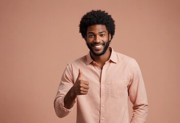 A man in a casual button-up shirt gives a thumbs up, his smile and afro hairstyle highlighting his friendly demeanor.
