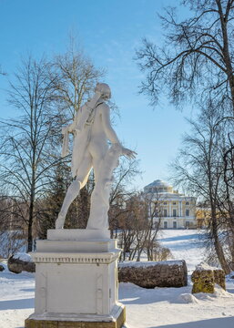White sculpture of Apollo in an ancient winter park