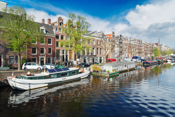 embankment of Amstel canal in Amsterdam at summer day, Netherlands