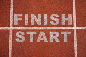 New beginnings concept. white starting line. Word start on a running track in a stadium. Top view.