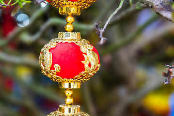 Chinese Lunar New Year decoration on tree signifying the spring season. 