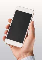 Human hand holding blank screen smart phone