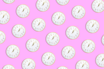 Pattern made with clock dials with golden details on bright pink background.
Creative minimal art. Flat lay. Copy space. Minimal composition.