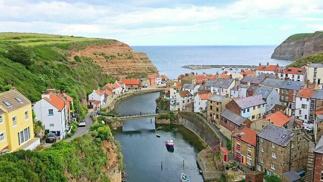 Pan over of the traditional fishing village village of Staithes, North Yorkshire Coast, England