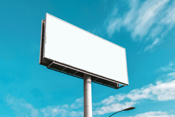 Obraz premium Large empty billboard - blank space is transparent - against clear blue sky. Mockup banner. Generative AI 
