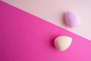 Beauty blender on a colored background. Bright sponges for cosmetics. Makeup products. Beauty...