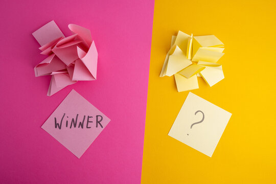 Lottery ticket with the word winner on a colored background near sheets of paper. Winner concept - Powered by Adobe