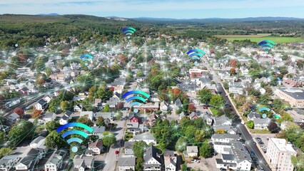 Wifi and 5G data network connectivity over neighborhood suburb in USA. Aerial above American home and houses. 3D graphic