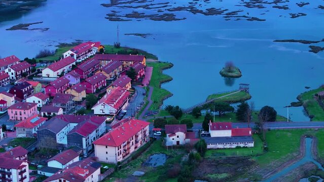 Church of Santa Cruz and town of Escalante seen from a drone in the Parque Natural de las Marismas de Santo&ntilde;a, Victoria y Joyel Natural Park. Cantabrian Sea. Escalante, Cantabria, Spain, Europe