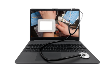 Laptop and medical stethoscope on a transparent background. On the laptop screen - a tonometer with a blank white screen on the hand against the background of a table with medicines