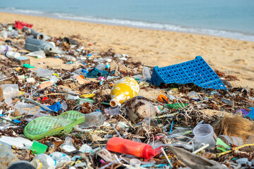 Plastic rubbish covers the sandy beach