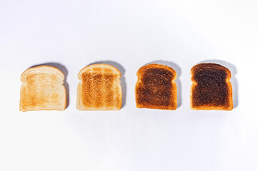 Different stages of toast, toasted square bread slices