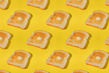 Creative food background, pattern with a slices of toasted bread and butter