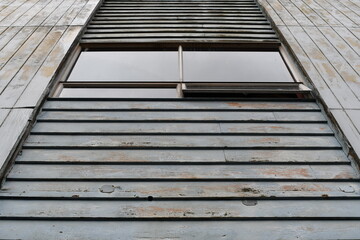 Sliding window with older siding.