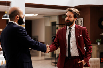 Business partners shake hands after meeting, deciding to work together on future collab, successful international conference. Two professionals agreeing to collaborate, forge alliances. - obrazy, fototapety, plakaty