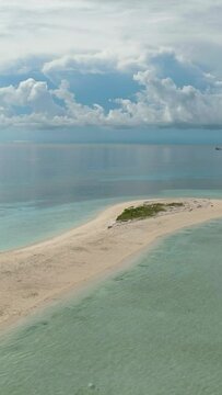Tropical landscape with a beautiful beach. Timba Timba islet. Tun Sakaran Marine Park. Borneo, Sabah, Malaysia. Vertical video.