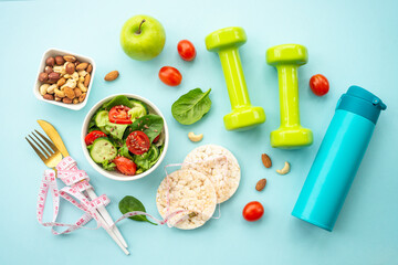 Diet food, healthy lifestyle and fitness background on blue.