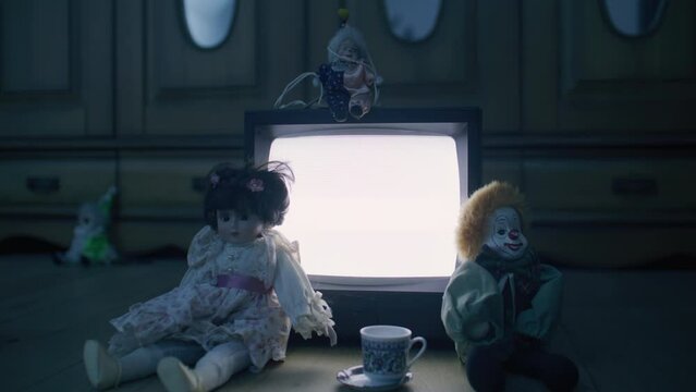 Creepy toys in an empty room at night.