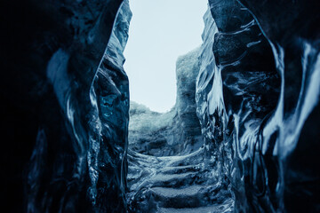 Big ice rocks inside glacier crevasse, transparent vatnajokull ice caves in icelandic landscapes....