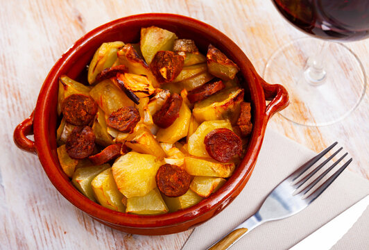 Spanish dish - potatoes with sliced chorizo sausage