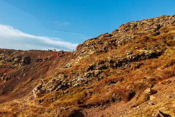 Massive steep mountain cliffs in highlands of Iceland, rock formations creating gorgeous slopes along icelandic valley. Wilderness on northern shoreline created by rocky hills.