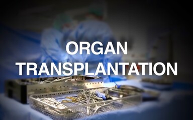 Organ transplantation lettering, operating room with surgeons on the patient in the background,...