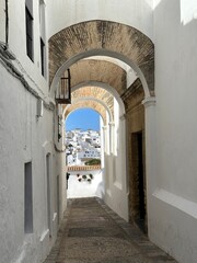 narrow archway in the old town of Vejer de la Frontera with a view of the city, hilltop town near Cádiz, Andalusia, Costa de la Luz, Spain, Europe