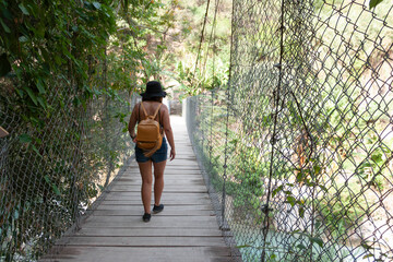 Healthy lifestyle woman walks on exploratory trip surrounded by vegetation in tropical climate in Mexico, Hidalgo state