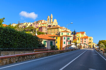View from the coastal road of the hilltop medieval village of Cervo, along the Mediterranean Riviera in the Imperia Province of Liguria, Italy. - Powered by Adobe