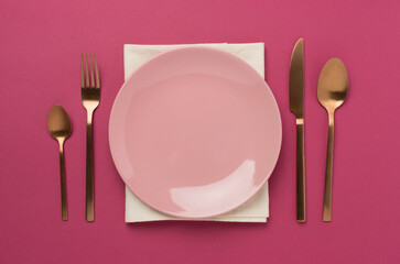 Minimal table setting on color background, top view
