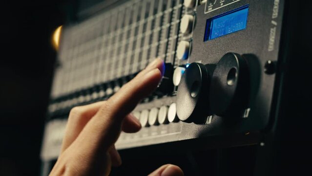 Soundboard pads station close-up. Sound designer use digital audio mixer in production studio. Sound engineer sliders in radio station. Engineer press key buttons control desk recording TV studio