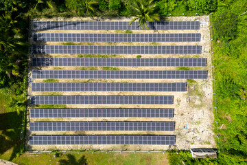 Aerial drone view of solar panels in a small solar plant generating renewable energy in the Amazon...