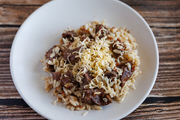 Giouvetsi - traditional Greek and Cretan baked dish with beef and orzo pasta in tomato sauce, top view