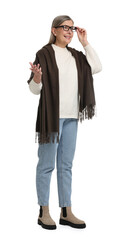 Full length portrait of senior woman on white background