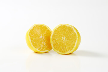 Two fresh lemon halves - 746175019