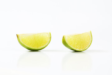 Two lime fruit wedges - 746175073