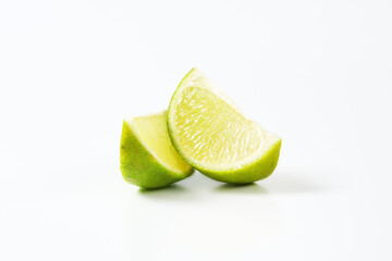 Two lime fruit wedges - 746175079