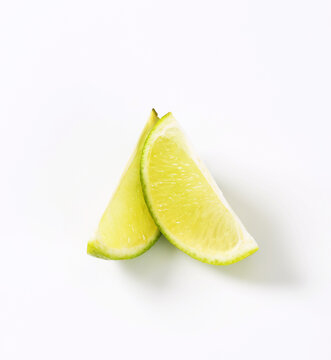Two lime fruit wedges