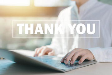 businessman using a laptop sends the message thank you on a display screen. concept of thank you business, appreciation and gratitude, congratulations, presentation from technology digital