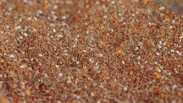 Mix spices dried pink, black pepper, green dill, red paprika, yellow turmeric, garlic, salt close-up macro. A bunch of natural spice for food .Seasonings and condiments concept