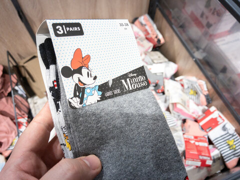 BELGRADE, SERBIA - FEBRUARY 4, 2024: Selective blur on Minnie Mouse socks for sale in a supermarket. It's a famous Disney character used for fashion merchandise.