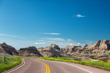 Embark on an awe-inspiring journey through the rugged beauty of Badlands National Park in South Dakota. A landscape etched by time awaits exploration.