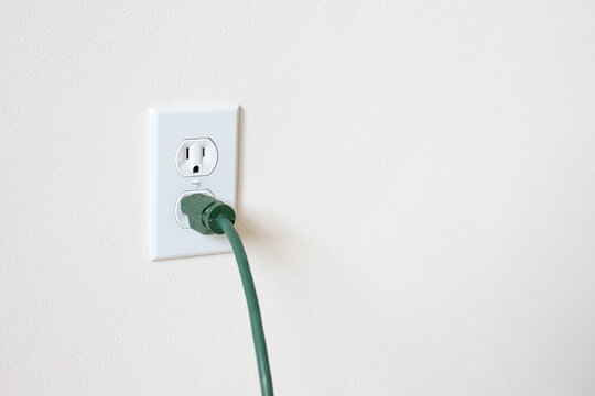 Power cord plugged in. Electrical outlet