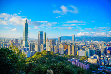 Fototapeta premium Taipei, Taiwan, Republic of China, 01 21 2024: Taipei City (in Republic of China, Taiwan) and mountain at sun set seen from elephant mountain park